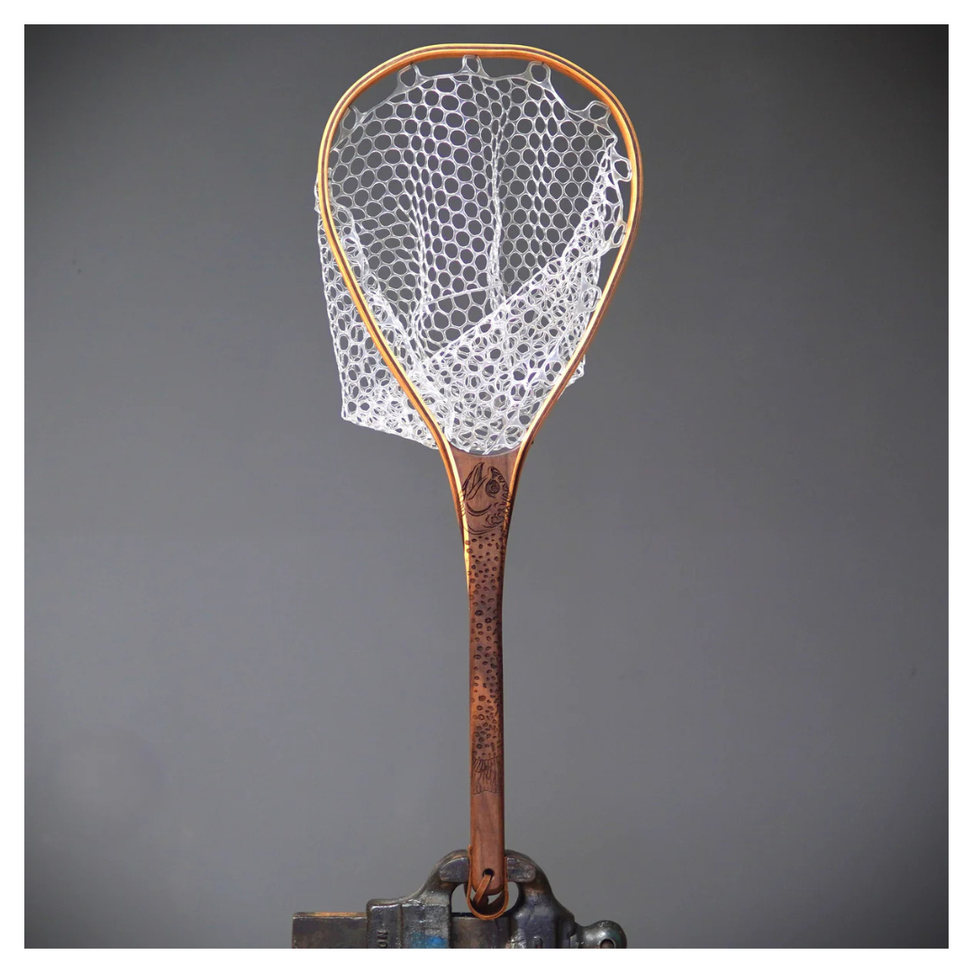 Fishing net with wooden handle on a gray background